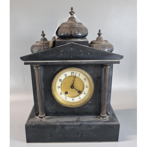 83 - Early 20th century black slate two train architectural mantel clock, the case surmounted by minarets... 