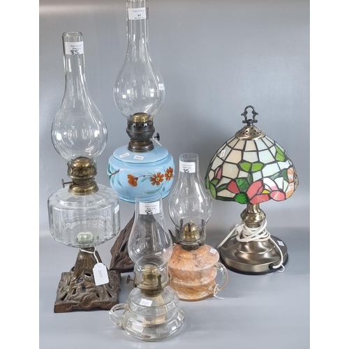 85 - Group of assorted  lamps to include: four brass single burner oil lamps, two with cast metal bases, ... 