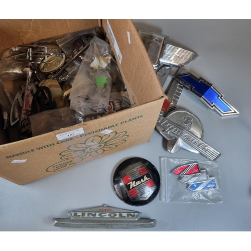 183 - Box of assorted vintage chrome and other car badges/mascots to include: Plymouth, Panhard, Oldsmobil...