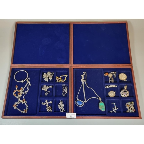 252 - Two modern wooden jewellery cases with assorted silver jewellery, to include: silver and amber neckl... 