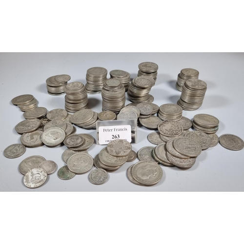 263 - Collection of mainly silver coins to include: half crowns, florins etc.  The bag weighing 82 troy oz...