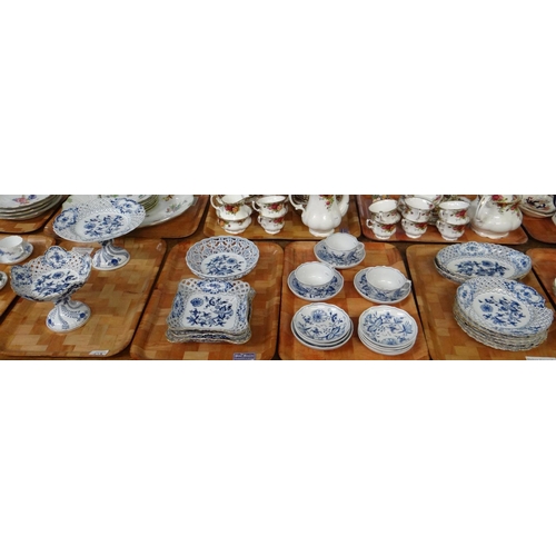 273 - Four trays of blue and white Meissen porcelain 'Blue Onion' design items to include: teacups and sau... 