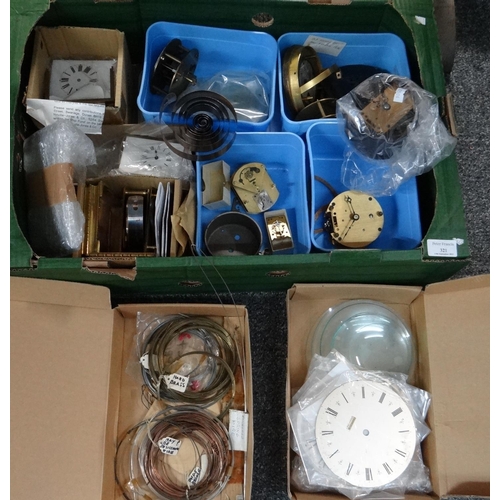 321 - Box of clock parts to include: various metal wires, metal and enamel clock faces, watch and clock gl... 