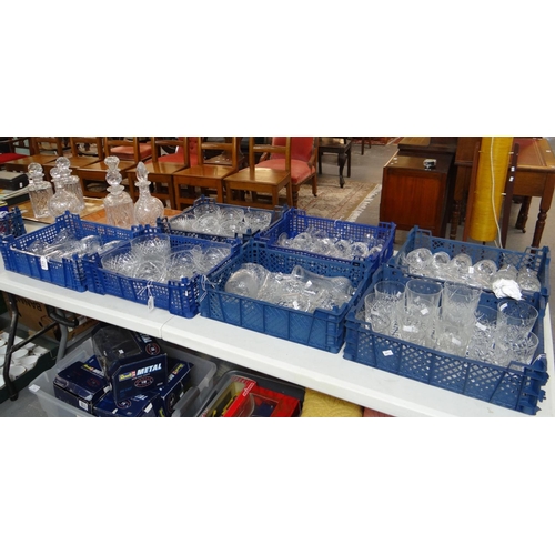 356 - Nine boxes and trays of glassware to include: various shapes of cut and moulded glass decanters and ... 