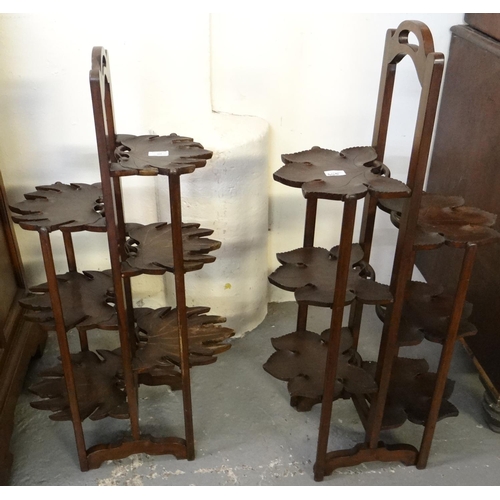 445 - Two similar stained hardwood novelty six tier cake stands in the form of stylised leaves.  (2)  (B.P... 