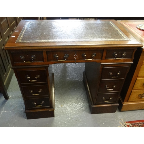 446 - 20th century mahogany leather top knee hole desk having a bank of three drawers on each pedestal on ... 