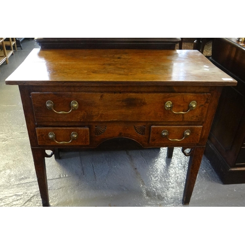 448 - Early 19th century oak low boy, the moulded and reeded top above an arrangement of one long and two ... 