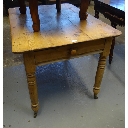 460 - 19th century stripped pine kitchen table with single frieze drawer on ring turned legs with casters.... 