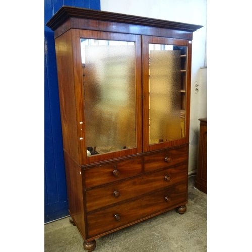 463 - 19th century mahogany press cupboard now with two mirrored doors revealing sliding shelves to the in... 