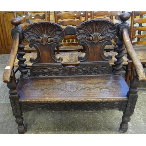 467 - Late 19th century Victorian carved oak hall settle, now altered to incorporate the backs of two earl... 