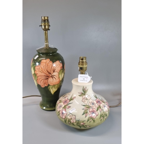 77 - Two Moorcroft pottery tube-lined table lamps of baluster and squat form with Spring Blossom design p... 