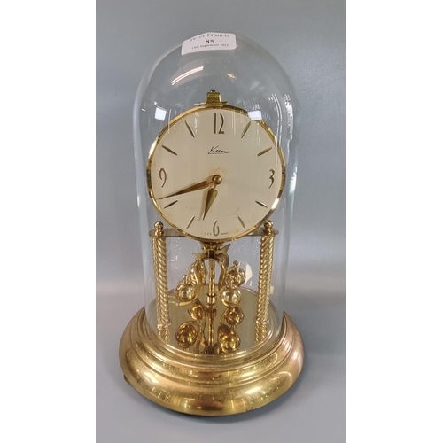 85 - Kern German made brass perpetual motion dome clock, with glass dome.  Overall 31.5cm high approx.  (... 