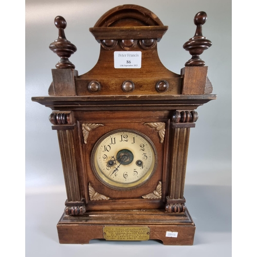 86 - Early 20th century walnut two train architectural presentation mantle clock with a plaque dated 1913... 