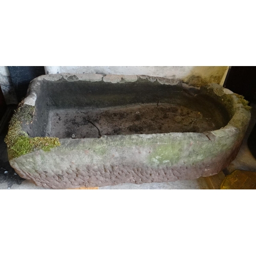 477 - Large sandstone garden trough of arched form.  115cm long approx.  (very heavy).  (B.P. 21% + VAT)