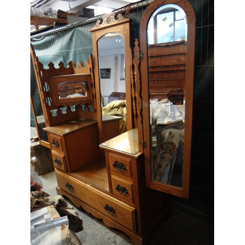 489 - Edwardian oak dressing table with bevelled wing mirrors, centre mirror and triangular cupboards.  12... 