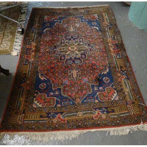 497 - Modern Persian design red ground floral and foliate runner with an arrangement of medallions to the ... 