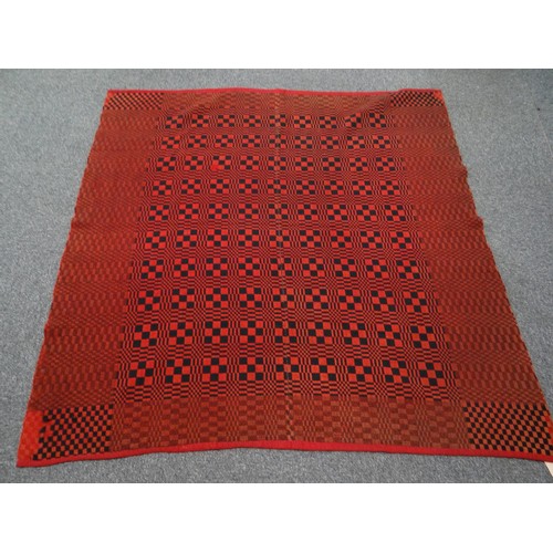 143 - Dark red and black vintage woollen small narrow loom Welsh tapestry blanket in check design.
(B.P. 2... 