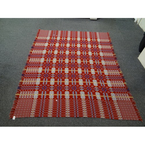 142 - Dark red ground Welsh tapestry woollen geometric design blanket with fringed edge. 
(B.P. 21% + VAT)