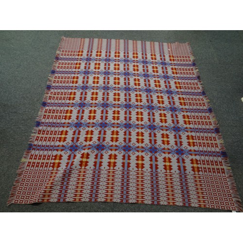 142 - Dark red ground Welsh tapestry woollen geometric design blanket with fringed edge. 
(B.P. 21% + VAT)