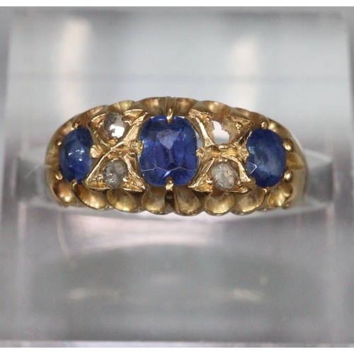 193 - Victorian gold six stone diamond and blue stone ring. Indistinct hallmarks, missing one stone. 2.7g ... 