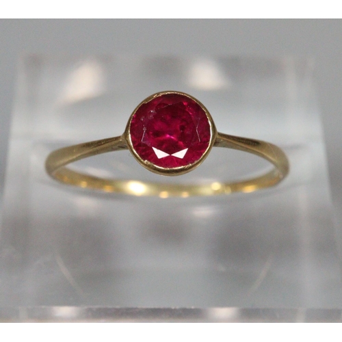 196 - 18ct gold and red stone dress ring. 1.1g approx. Ring size N.
(B.P. 21% + VAT)