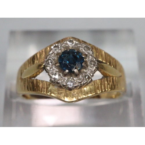 200 - 18ct gold bark finish diamond and sapphire ring. Size K1/2. 4.6g approx.  (B.P. 21% + VAT)