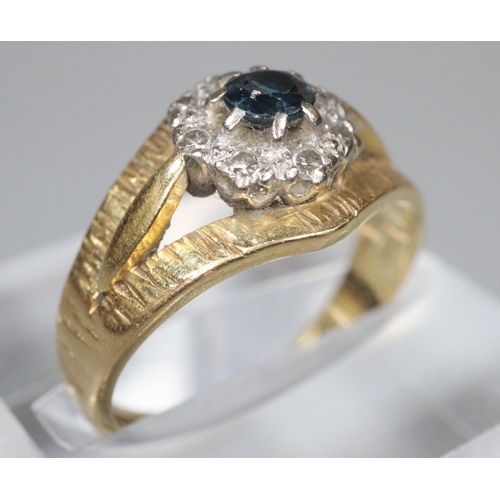 200 - 18ct gold bark finish diamond and sapphire ring. Size K1/2. 4.6g approx.  (B.P. 21% + VAT)