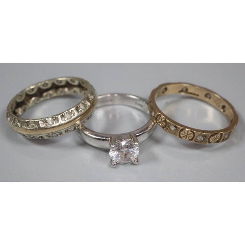 201 - 9ct gold eternity style ring (1.8g approx), together with a silver solitaire design dress ring and a... 