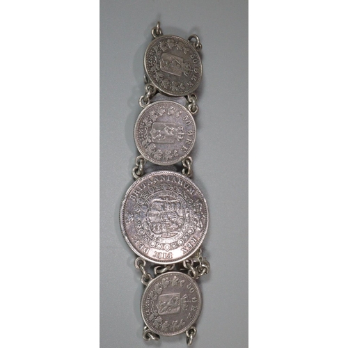 209 - Silver seven coin bracelet featuring 50 Ore Danish coins. 
(B.P. 21% + VAT)