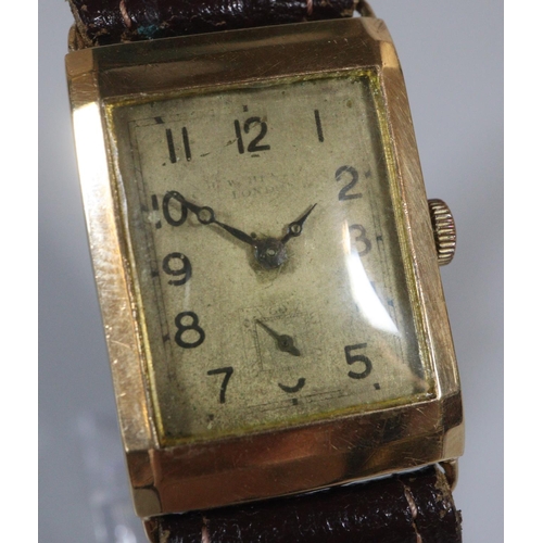 244 - 9ct gold rectangular gent's wristwatch with leather strap, the face indistinctly marked.
(B.P. 21% +... 