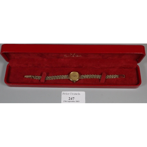 247 - 9ct gold Omega ladies wristwatch in original box, having circular face marked 'Swiss made'. 15.4g ap...