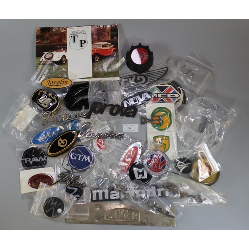 254 - Box of assorted vintage and other car badges to include: YKC, Stylus sports cars, metal plate marked... 