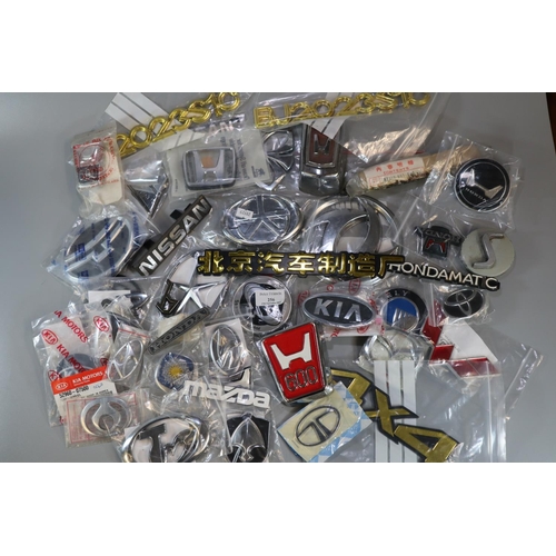 256 - Collection of assorted vintage and other car badges to include: Hondamatic, Kia, Nissan etc.
(B.P. 2... 