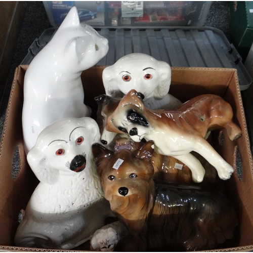 309 - Box of ceramic dog figures to include: Staffordshire seated spaniels, Capstan pottery Yorkshire terr... 