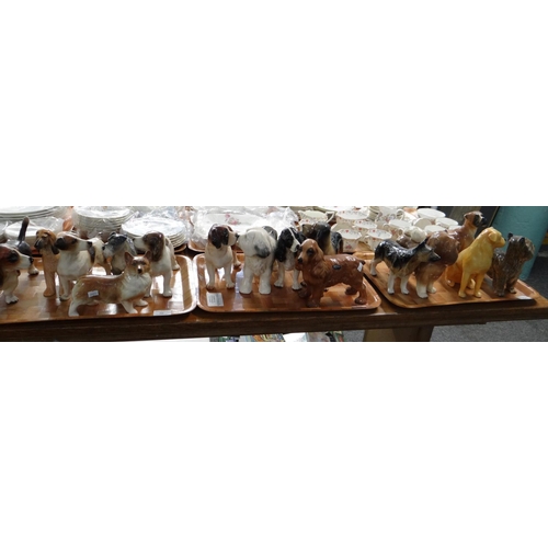 316 - Three trays of ceramic dogs to include: Coopercraft, Melba ware and others; Corgi, Beagle, Schnauzer... 