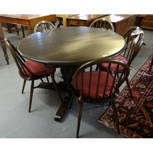 434 - Mid century Ercol elm dining room suite comprising rack back dresser, circular dining table on quatr... 