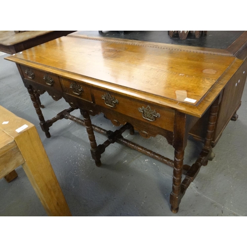 451 - 18th century style oak dresser base, the moulded top above an arrangement of three drawers with carv... 