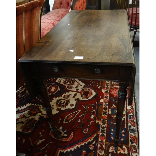 458 - Victorian mahogany Pembroke table on ring turned tapering legs and brass casters.
(B.P. 21% + VAT)