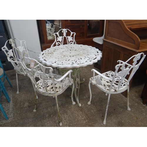 472 - Modern weathered metal pierced garden table and four chairs.
(B.P. 21% + VAT)