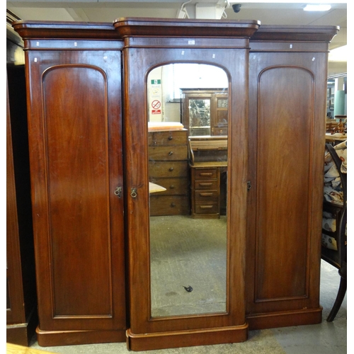 484 - Victorian mahogany break front mirrored triple section wardrobe.
(B.P. 21% + VAT)