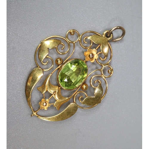 255 - 9ct gold and peridot Art Nouveau design pendant.  2.5g approx.  (B.P. 21% + VAT)