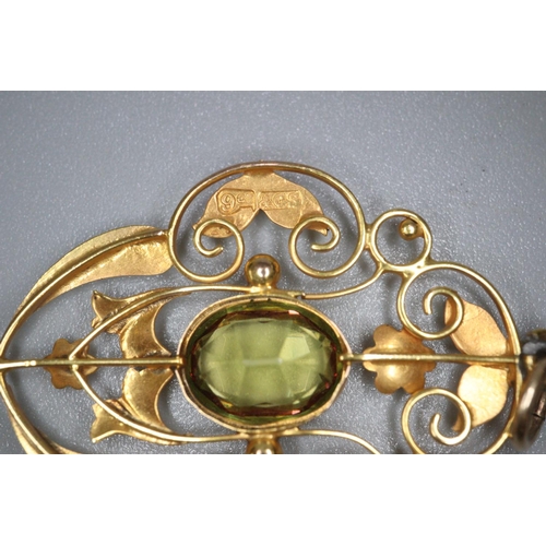 255 - 9ct gold and peridot Art Nouveau design pendant.  2.5g approx.  (B.P. 21% + VAT)