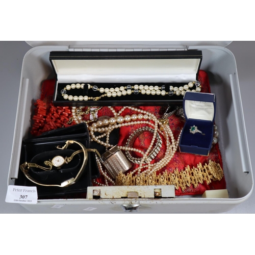 307 - Tin cash box comprising assorted costume jewellery and other items to include: necklaces, pearls, dr... 