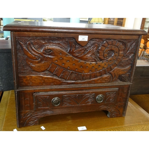 493 - Unusual carved and stained coffwr bach, the moulded hinged top above a front panel with mythical cre... 