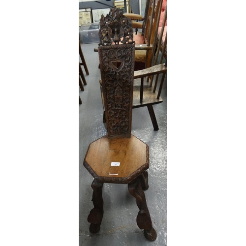 513 - Unusual early 20th century carved spinning chair, probably of Indian or Thai origin, the back panel ... 