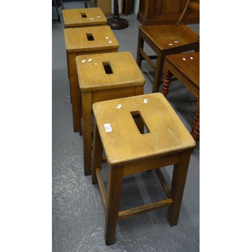 519 - Set of four mid century beech laboratory stools with hand holes.  (4)  (B.P. 21% + VAT)