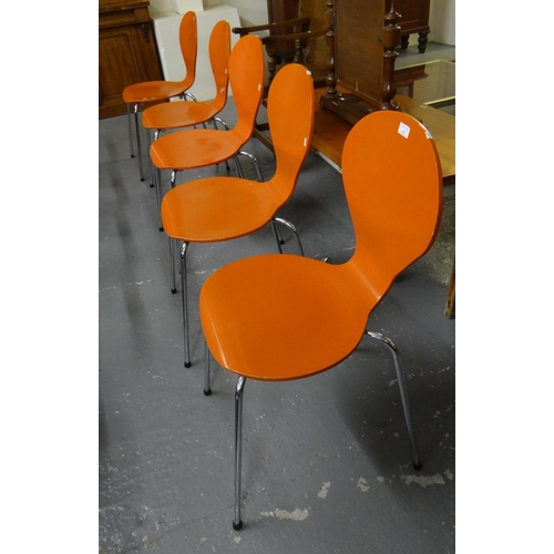 524 - Set of of five modern bistro style orange stackable chairs on chrome legs.  (5)  (B.P. 21% + VAT)