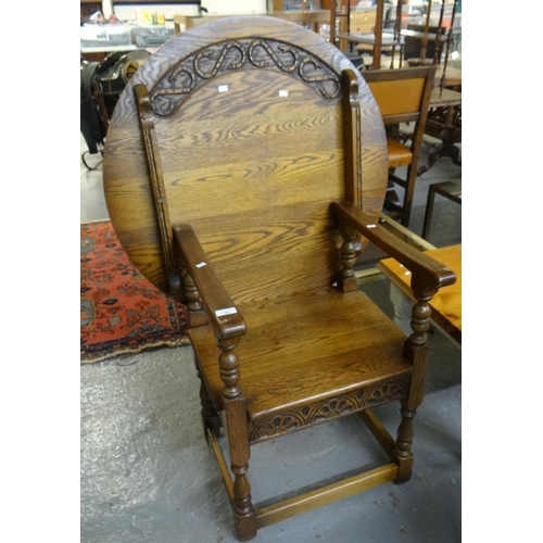 526 - Early 20th century oak Monk's Seat with carved circular back an moulded seat.  (B.P. 21% + VAT)