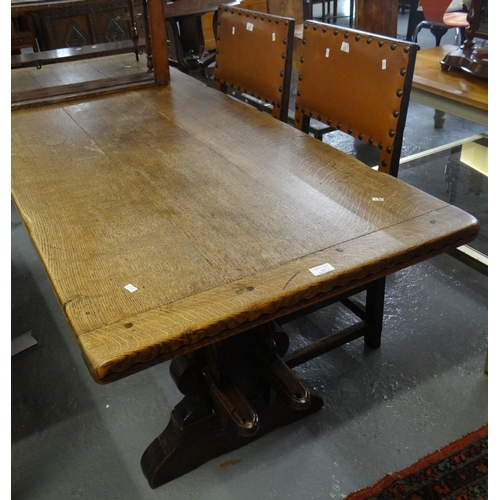 531 - Early 20th century oak cleated three plank top refractory type  table together with two leather fini... 