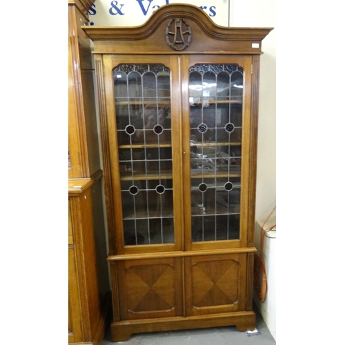 539 - Early 20th century mahogany two door glazed stained glass and leaded bookcase on bracket feet.  (B.P... 